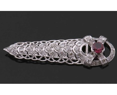 A diamond and synthetic ruby pendant, the round brilliant cut synthetic ruby, 6mm diameter, set within a cross to the base of