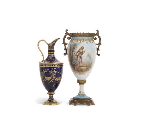 A late 19th Century continental porcelain sevres style vase with gilt metal mounts painted with a gentleman and castle in bac