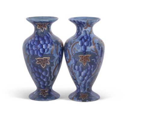 A pair of Bursley ware vases with a blue Art Deco type design, pattern number 585, probably designed by Charlotte Rhead.  NOT