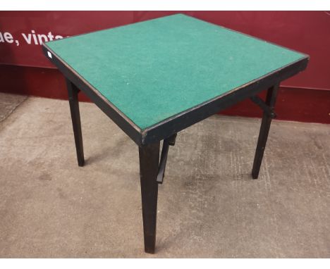 A beech and green velvet topped folding card table