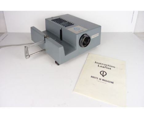 A boxed Boots QI magazine projector