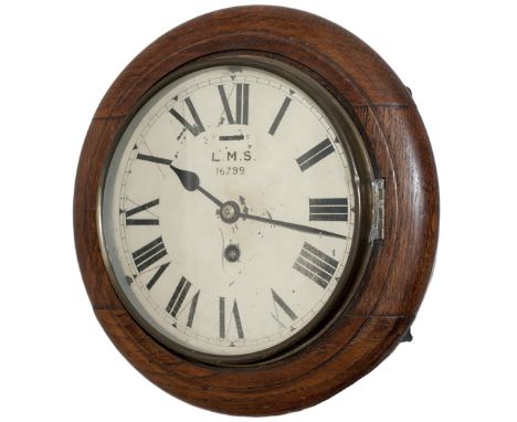 LMS 8 inch oak cased railway clock with a Smiths Empire going barrel movement. The original dial is lettered LMS 16799. In ni