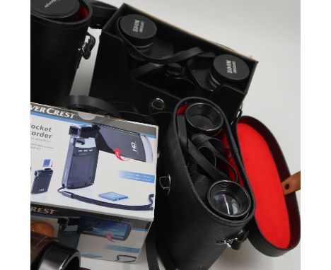 Four pairs of binoculars including Chinon and Swift, all in good working order, with an unused and boxed pocket camcorder, co