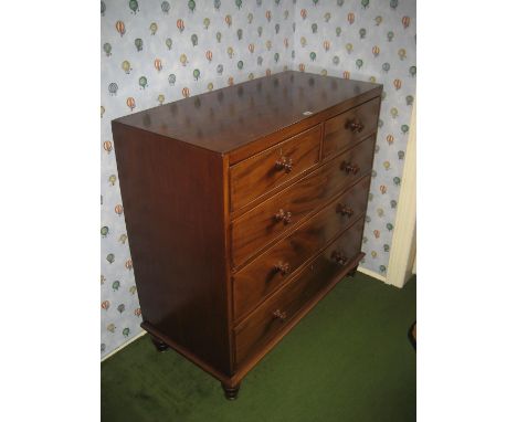 A late 19th century mahogany caddy top chest of drawers.