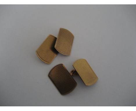 A pair of 9ct gold engine turned cuff links, 3.9g.