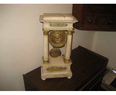 A late 19th century alabaster Portobello clock with central swinging pendulum