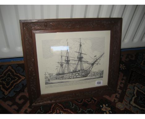 A framed print of HMS Victory in carved oak frame.