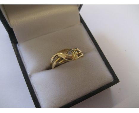 An 18ct single diamond serpent ring 2.9g all in.
