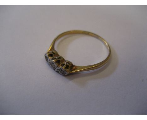 A three stone 18ct gold diamond ring, 2.2g.