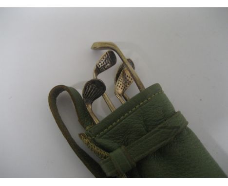 A novelty silver golf club manicure set, the clubs stamped 'sterling'.