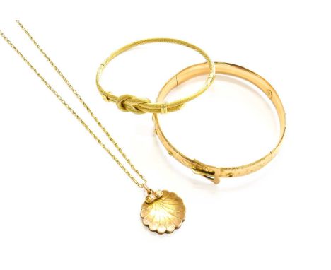 A Lover's Knot Motif Hinged Bangle, stamped '585', inner measurements 6.1cm by 4.8cm; A Buckle and Belt Motif Hinged Bangle, 
