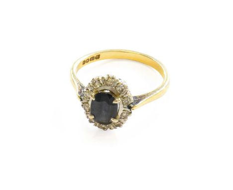 An 18 Carat Gold Sapphire and Diamond Cluster Ring, finger size MGross weight 3.2 grams