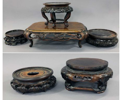 A Chinese Carved Hardwood Rectangular Stand, 19th century, carved with bamboo leaves to the shaped apron and raised on scroll