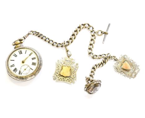 A silver pair cased pocket watch with a curb link silver chain, attached two silver medals and a fob