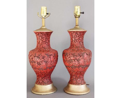 A Pair of Chinese Cinnabar Style Vases, of baluster form, carved with figures amongst foliage, converted to lamp bases, 33cm 