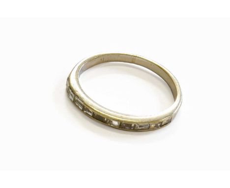 A Diamond Half Hoop Ring, unmarked, finger size MEvidence of re-sizing. Gross weight 2.0 grams.