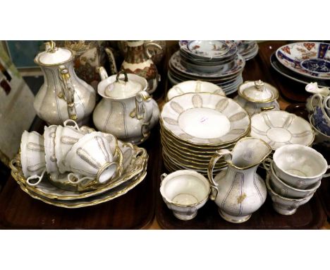 A KPM Porcelain Part Tea and Coffee Service, 19th century, with panels of vermicelli gilding under wet blue bands, underglaze