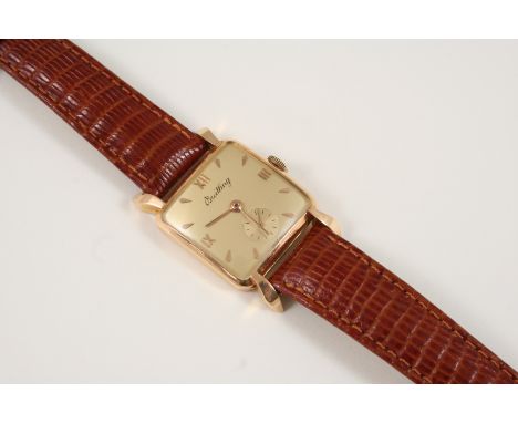 AN 18CT. GOLD MECHANICAL WRISTWATCH BY BREITLING the signed cushion-shaped dial with Roman and dagger numerals, subsidiary se