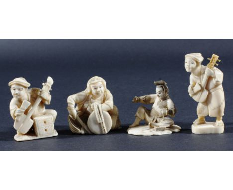 JAPANESE IVORY NETSUKE, modelled as a man seated with a wooden box, red seal signature, height 5cm; together with three ivory