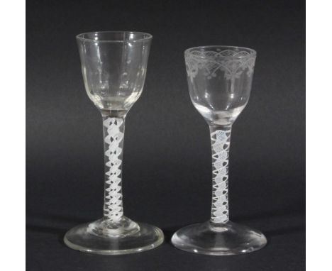 GEORGE III WINE GLASS, the rounded bowl with basal moulding above a white enamel triple helix and spreading foot, height 15cm