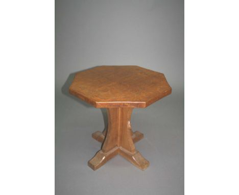 ROBERT THOMPSON OF KILBURN - MOUSEMAN SIDE TABLE an octagonal side table, made in oak with a central column and adzed top. Ca