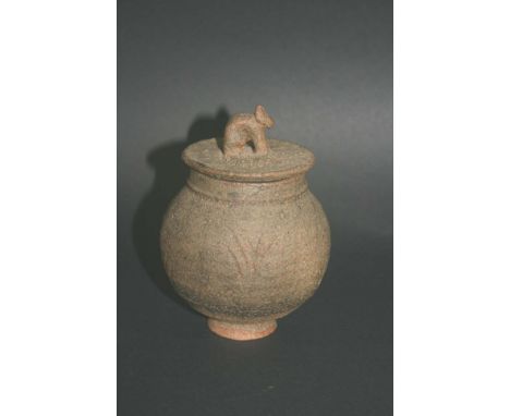IAN GODFREY - STUDIO POTTERY a small lidded stoneware pot, with incised decoration and an animal shaped finial. Unmarked, wit
