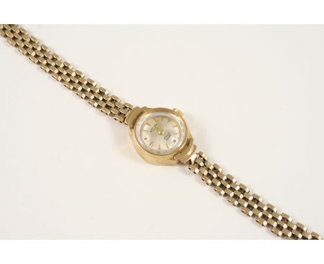 A LADY'S 9CT. GOLD WRISTWATCH BY ROTARY the signed circular dial with dagger numerals, on a gold bracelet with ladder clasp.