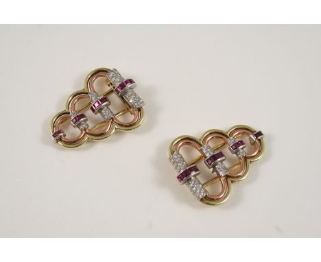 A PAIR OF RUBY, DIAMOND AND GOLD CLIP BROOCHES BY CARTIER each formed as three graduated two colour gold double hoops mounted