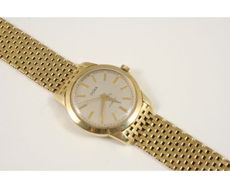 A GENTLEMAN'S 18CT. GOLD WRISTWATCH BY DOXA the signed circular dial with baton numerals and sweep seconds hand, on a gold me
