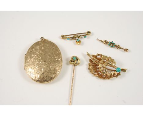 A 9CT. GOLD LOCKET PENDANT of oval shape with engraved foliate decoration to one side, 5 x 4cm., together with three gold and