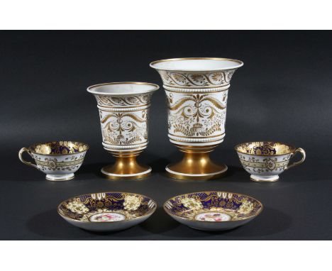 GRADUATED PAIR OF SPODE CAMPANA VASES, circa 1820, painted with a floral spray between beaded bands and above a gilt foot, ir