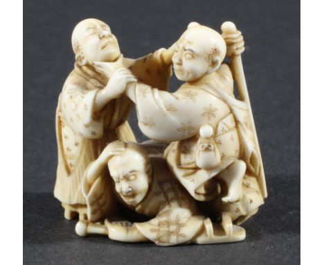 JAPANESE IVORY NETSUKE, modelled as three men fighting, signature to base, height 3.5cm