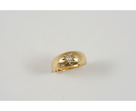 AN 18CT. GOLD GYPSY RING set with a circular-cut diamond. Size K.