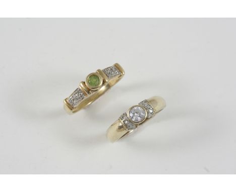 A DIAMOND AND PERIDOT RING the circular-cut peridot is set with small diamonds to each shoulder, in gold, size Q, together wi