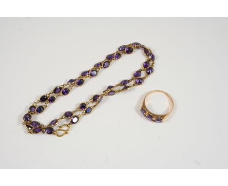 AN AMETHYST NECKLACE mounted with oval-shaped amethysts in gold collet settings, 42cm. long, together with an amethyst three 