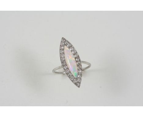 AN OPAL AND DIAMOND CLUSTER RING the marquise-shaped opal is set within a surround of old brilliant-cut diamonds. Size M 1/2.