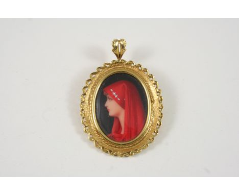 A GOLD AND ENAMEL PORTRAIT BROOCH PENDANT depicting a woman in a red scarf, in a gold ornate frame, 4.2 x 3.5cm.