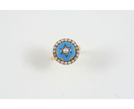 A VICTORIAN ENAMEL AND PEARL SET RING the domed turquoise enamel centre is set with gold decoration, a small pearl and rose-c