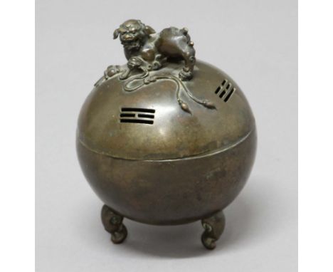 BRONZE CENSER, of spherical form with temple dog finial and on three scrolling legs, height 18cm