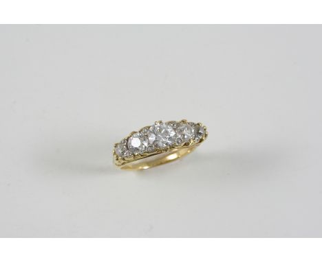 A VICTORIAN DIAMOND FIVE STONE RING the five graduated old brilliant-cut diamonds are set with rose-cut diamond highlights in