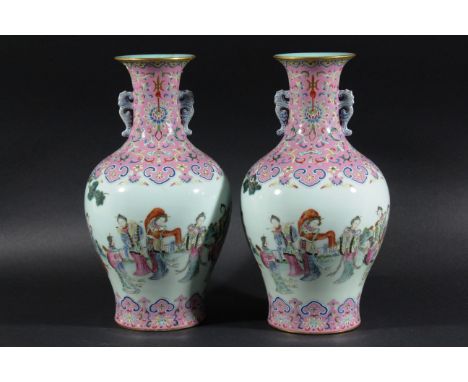 PAIR OF CHINESE VASES, Daoguang style and probably of the period, of two handled baluster form painted in the famille rose pa