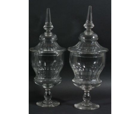 PAIR OF GLASS BON-BON JARS AND COVERS, early/mid 19th century, of faceted urn form on a baluster column and spreading foot, t