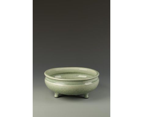 A CHINESE LONGQUAN CELADON TRIPOD CENSER, the rounded body with cross-hatched decoration, Ming, 11.75" dia.