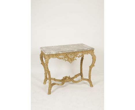 A LOUIS XV GILTWOOD AND MARBLE TOPPED CONSOLE TABLE, the rectangular top with moulded border, on a pierced scrolling frieze a