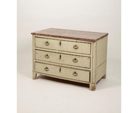 A LOUIS XVI MARBLE TOPPED THREE DRAWER COMMODE, the rectangular variegated red marble top above three cream and gilt lined dr