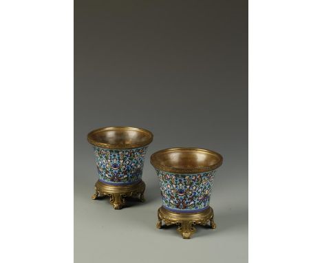 A PAIR OF CHAMPLEVE ENAMEL CACHEPOT of flared form with European stands, 19th century, 5" high (2)
