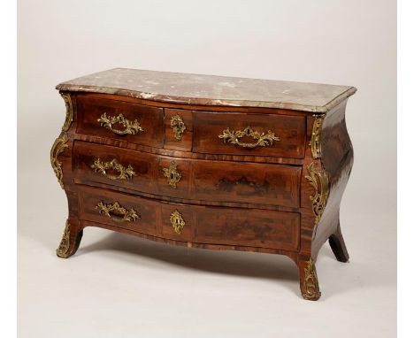 A LOUIS XV KINGWOOD ORMOLU AND MARBLE TOP COMMODE, the serpentine fronted top with moulded border above two short and a centr