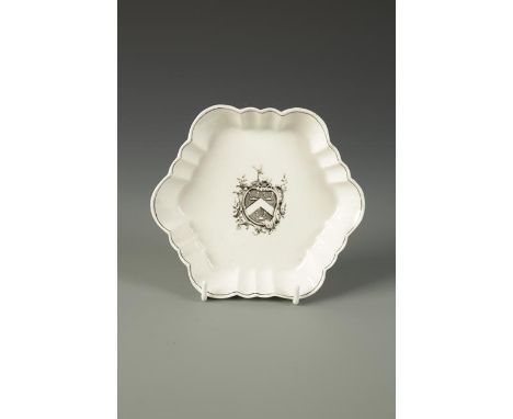 A WORCESTER HEXAGONAL TEAPOT STAND printed in black with the arms of Cocks, the fluted border with black line rim, c. 1772-75