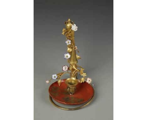 AN ORMOLU AND PORCELAIN MOUNTED WALL HANGING CHAMBER STICK with a Japanese lacquer dish with ormolu sconce mounted on a scrol