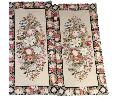 A PAIR OF TAPESTRY PANELS of French 18th century design, the central cream ground rectangular panel worked with a spray of fl